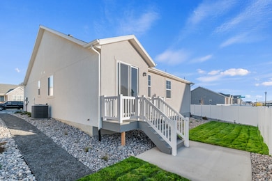 View of side of home featuring stucco siding, a residential view, and a deck