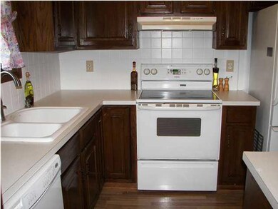 The kitchen floor is wood laminate.