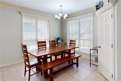 Dining area featuring light tile patterned floors,