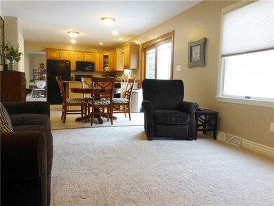 Family Room with 2 Windows Spills into the Kitchen
