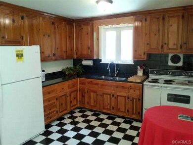 Kitchen with some retro shine, ceramic tile newly refinished cabinets, new granite counter top, new sink, new refrigerator...