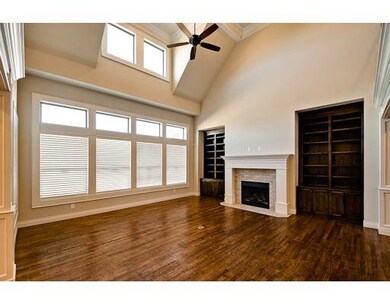 Living Room. Large windows, spacious room w/cast s