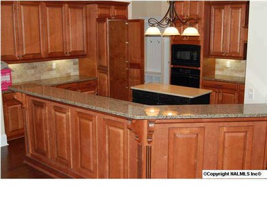 Magnificient chef's kitchen with coordinating island with quartz....granite on countertops