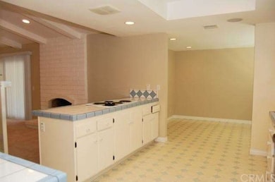Breakfast Bar and view to cozy eating Nook.  Could
