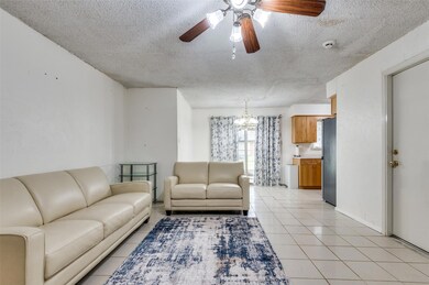 Living room featuring light tile patterned floors,
