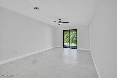 Spare room featuring visible vents, baseboards, a
