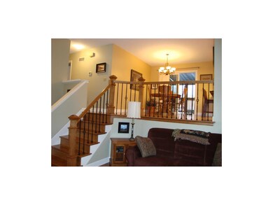 GLEAMING WOOD AND IRON RAILING UPDATES THIS HOME..