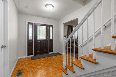 Entryway with baseboards and stairway