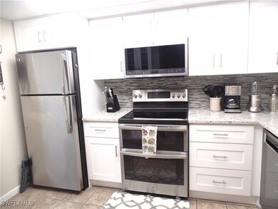 Kitchen featuring stainless steel appliances, whit