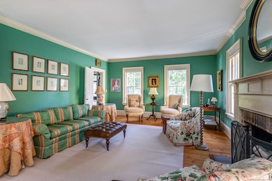 The living room is extremely spacious with ceiling height of 9 ft. with dental molding surrounding the room.