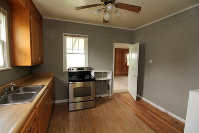 Kitchen leads into the large den at the back of the house. 