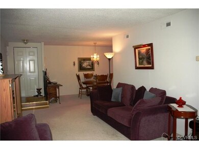 Foyer with coat closet and entrance to living room