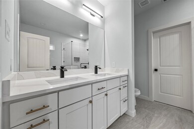 Kitchen featuring hanging light fixtures, sink, an