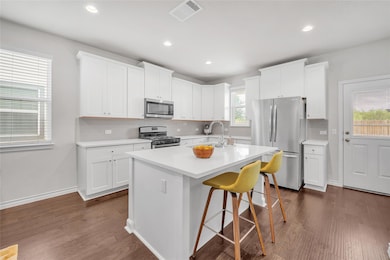 Kitchen featuring appliances with stainless steel