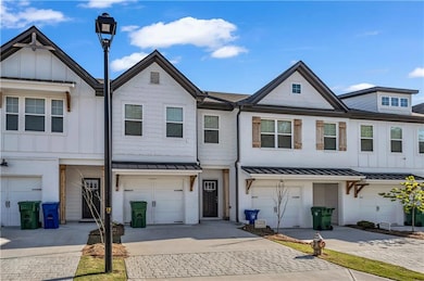 Multi unit property featuring brick siding, a stan