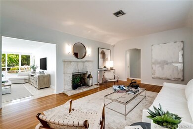 Living room features hardwood floors and charming 