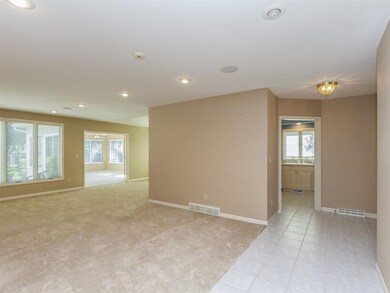 Living room with Gas fireplace is large and flows 