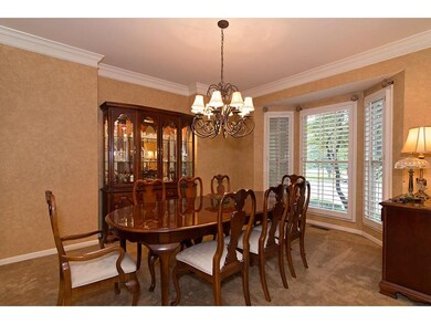 Formal Dining Room w/plantation shutters and crown
