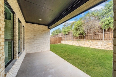 Fenced backyard featuring a patio