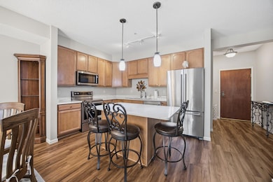The kitchen is fabulous with the updated stainless steel appliances, sink and faucet, handles on the drawers and cabinets, pendant lights and the gorgeous quartz countertops.  The kitchen may be your favorite room!
