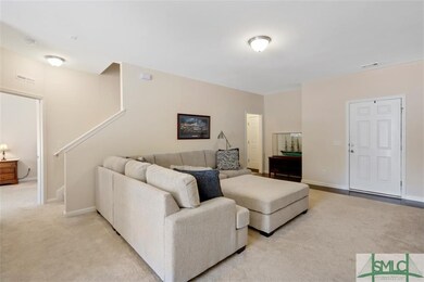 Family room with stairs leading to second level