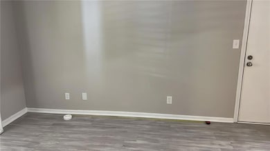 Unfurnished room featuring wood finished floors