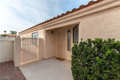 Property entrance with a gate to the back yard.