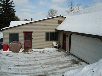 Exterior Back. Huge oversized heated garage.  Plen
