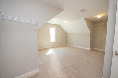 Bonus room featuring carpet flooring, visible vent