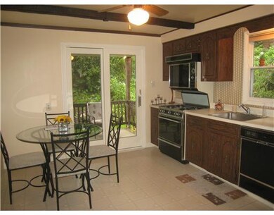 Kitchen. Sliding door to llarge covered wrap aroun