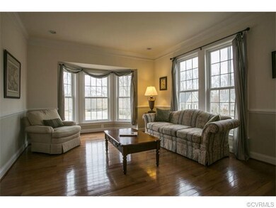 Formal living room with bay window.
