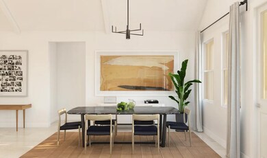 Dining area with white painted ceiling beams