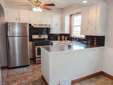 Kitchen has stainless steel appliances.