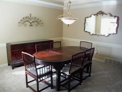Formal Dining Room  with high barrel top ceiling.