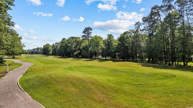 View of property's community featuring a lawn