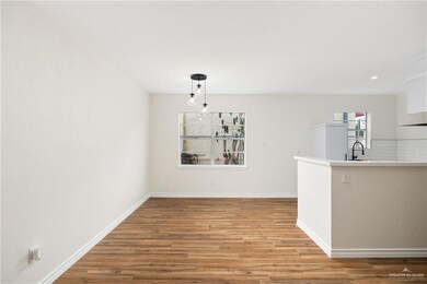 Unfurnished dining area with light hardwood / wood-style flooring and sink