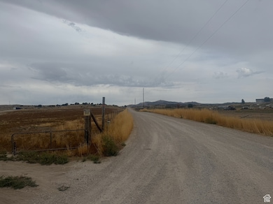 View of dirt / gravel road featuring a view of countryside
