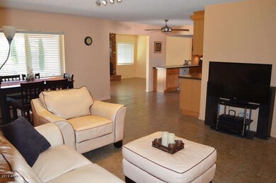 Kitchen and coxy den with fireplace