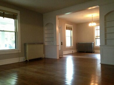 Built in bookshelves, high ceilings, and large win