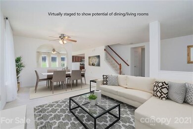 Combined dining and living rooms provide an excell