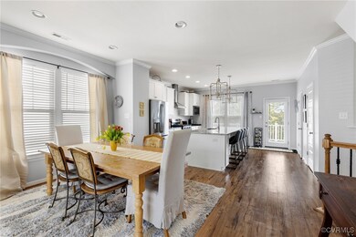 Dining room with crown molding, dark hardwood / wo