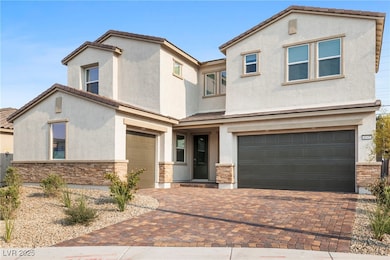 Mediterranean / spanish house featuring a garage,