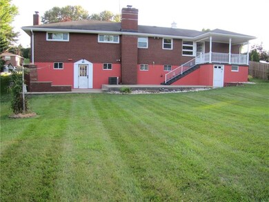 This view of the back of the home shows the walk o