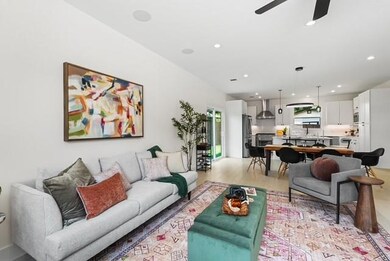 Living room with recessed lighting, ceiling fan, and light wood finished floors