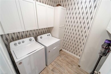 Laundry room with cabinets, independent washer and