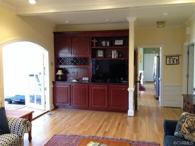 Fam. Rm. with quality cabinetry & wet bar! Opens t