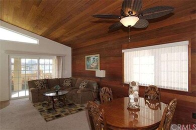 Dining room and living room leading to sliding doo