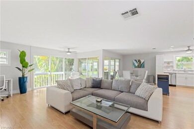 Living room with light wood-type flooring, ceiling