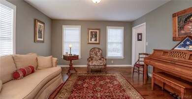 Living room featuring dark hardwood / wood-style f