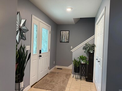 Tiled entry with generous coat closet